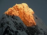 Rolwaling 06 02 Kang Nachugo Summit Close Up At Sunrise From Kabug Here is a close up of the summit area of the east face of Kang Nachugo (6735m) glistening at sunrise from Kabug.